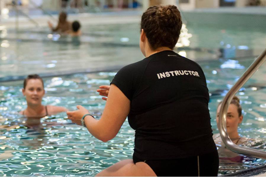 image of instructor and participants in pool