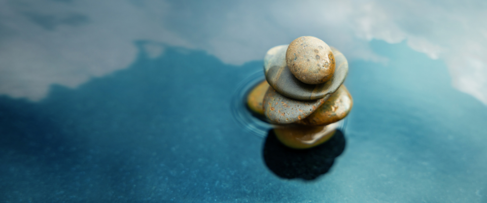 stacked stones in a pool of water