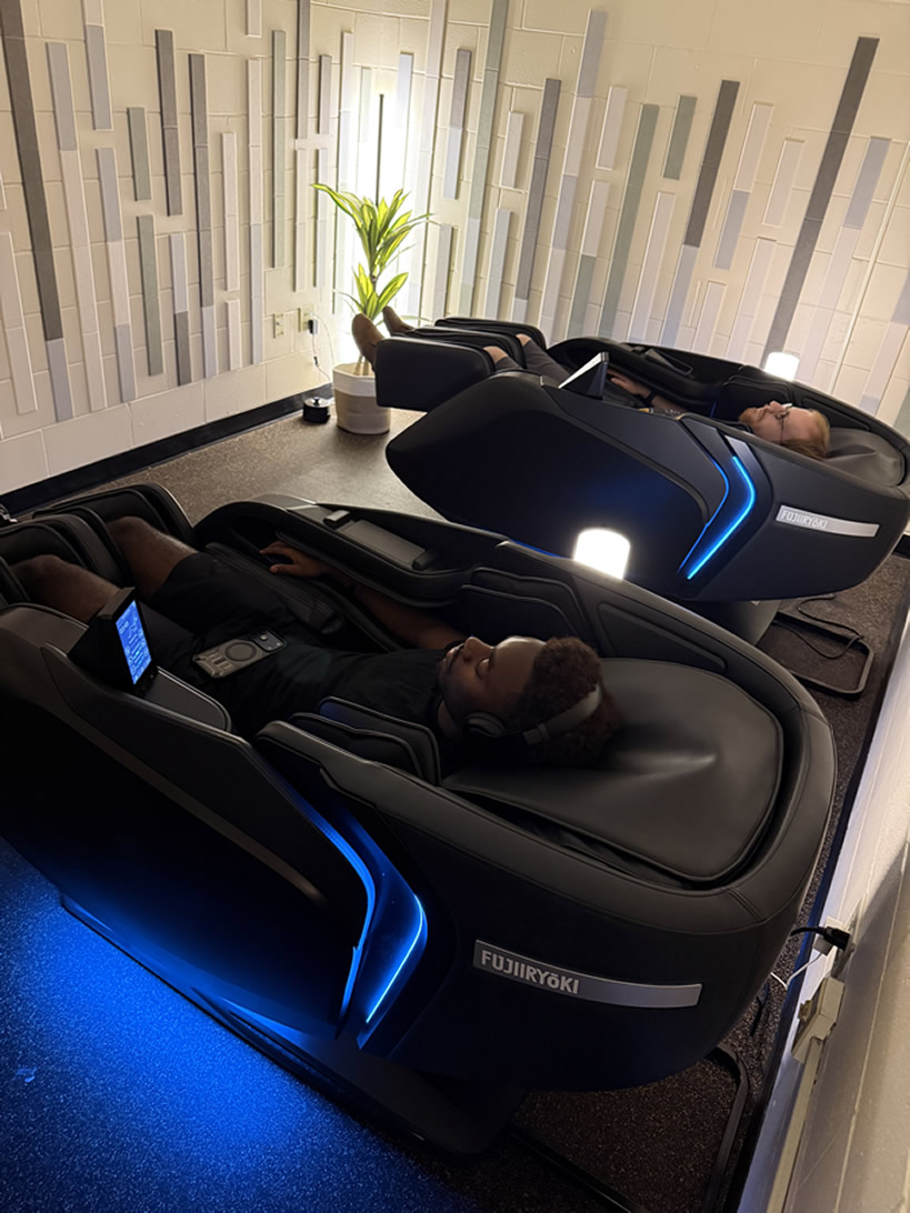 Electric massage chair with black upholstery