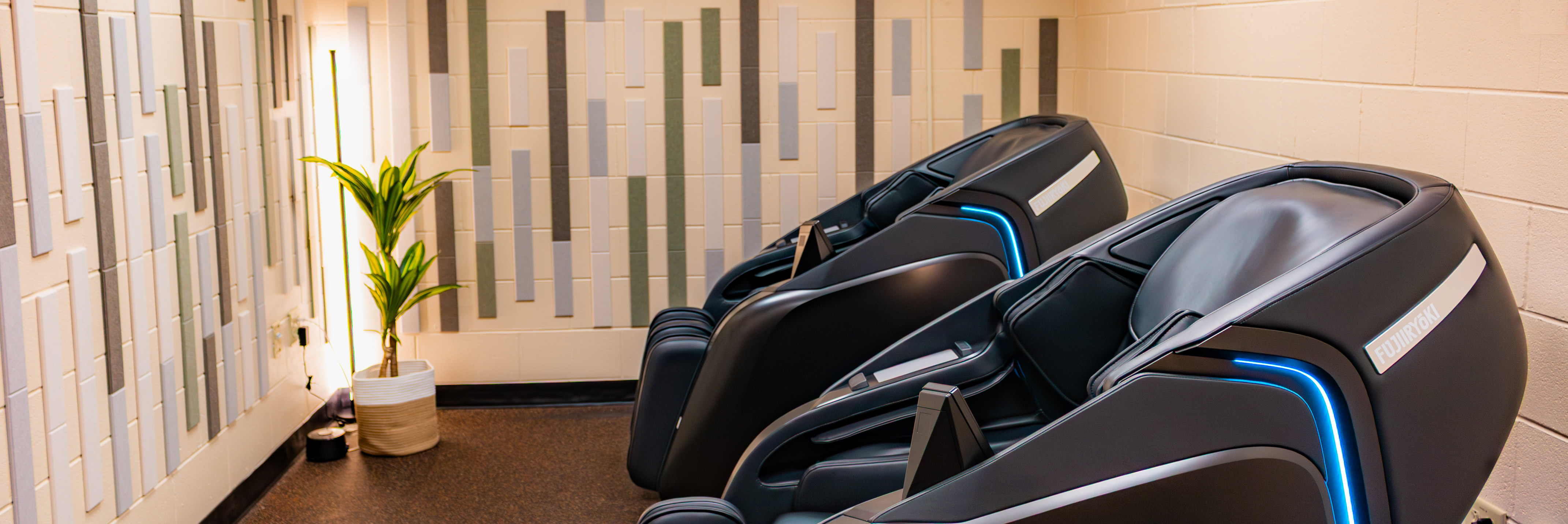 well being lounge image of two massage chairs in lounge area